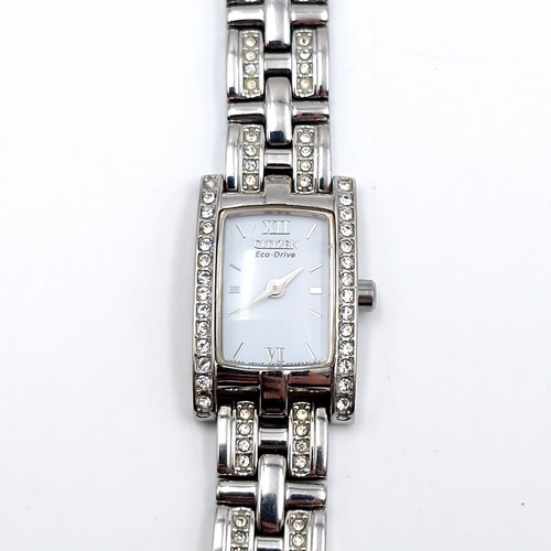 448 - A nice example of a Citizen Eco drive ladies wristwatch with gem set bezel and matching bracelet. RR... 