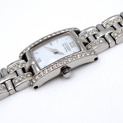 448 - A nice example of a Citizen Eco drive ladies wristwatch with gem set bezel and matching bracelet. RR... 