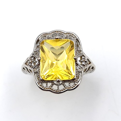 491 - A large citrine stone ring set in sterling silver with claw mount. Ring size - P. Weight - 4.98 gram... 