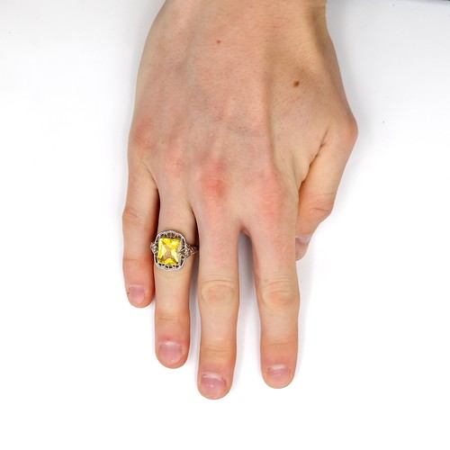 491 - A large citrine stone ring set in sterling silver with claw mount. Ring size - P. Weight - 4.98 gram... 