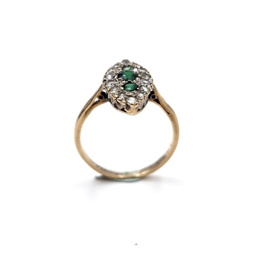 1117 - A nine carat gold (375) and Emerald gem set ring. Ring size - K 1/2. Weight - 1.75 grams. Boxed.