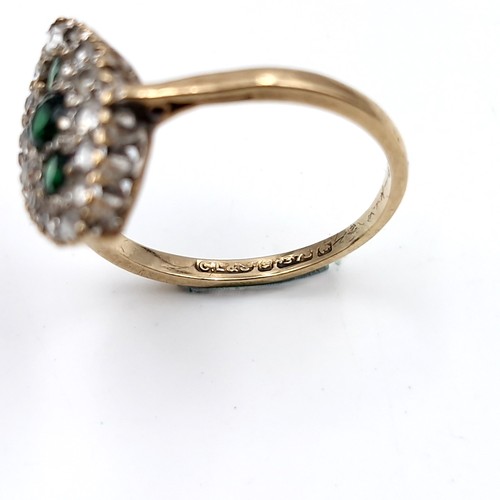 1117 - A nine carat gold (375) and Emerald gem set ring. Ring size - K 1/2. Weight - 1.75 grams. Boxed.