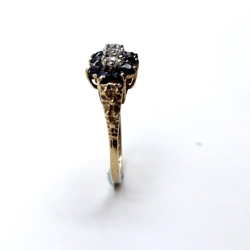 1118 - A pretty vintage sapphire ring with three gemstone accents mounted in nine carat gold. Ring size - K... 