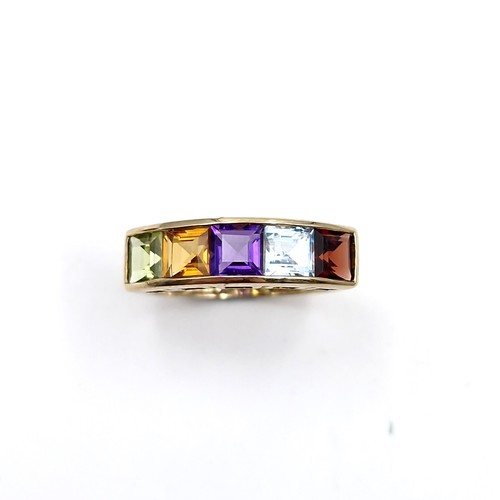 1119 - A vari hue gemset ring mounted in nine carat gold (375). Ring size - N. Weight - 2.12 grams. Boxed.