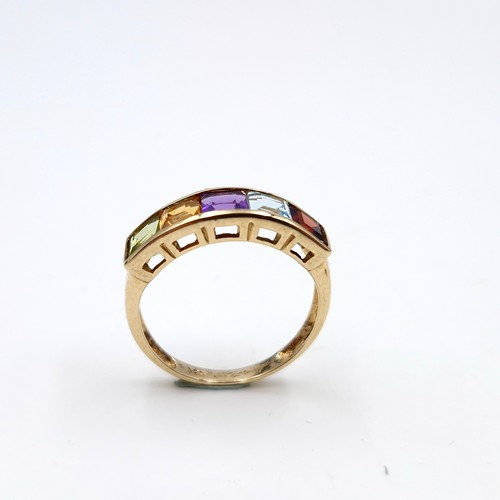 1119 - A vari hue gemset ring mounted in nine carat gold (375). Ring size - N. Weight - 2.12 grams. Boxed.