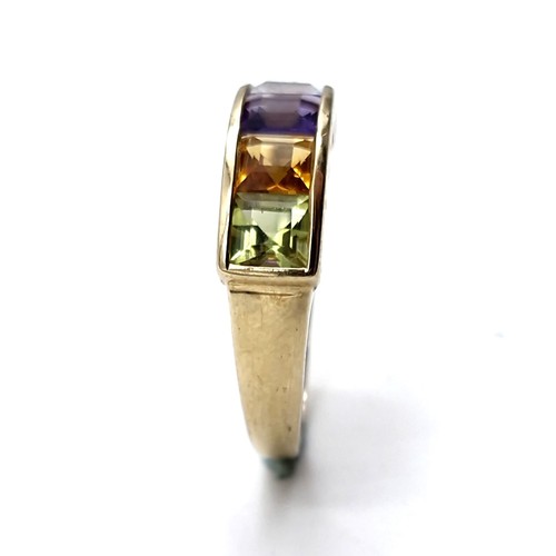 1119 - A vari hue gemset ring mounted in nine carat gold (375). Ring size - N. Weight - 2.12 grams. Boxed.