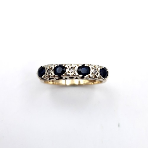 1120 - Star Lot : A pretty four stone sapphire ring with diamonds set in nine carat gold (375). Ring size -... 