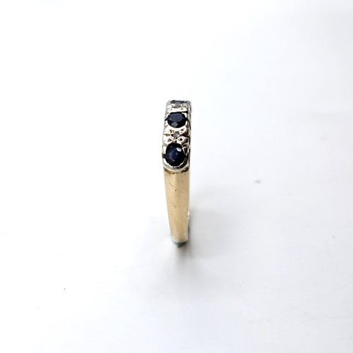 1120 - Star Lot : A pretty four stone sapphire ring with diamonds set in nine carat gold (375). Ring size -... 