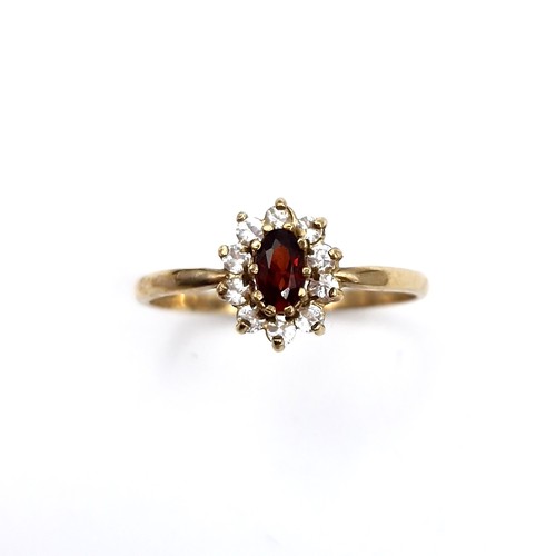 A very pretty vintage ladies 9ct gold flower design gemset ring. Size Q