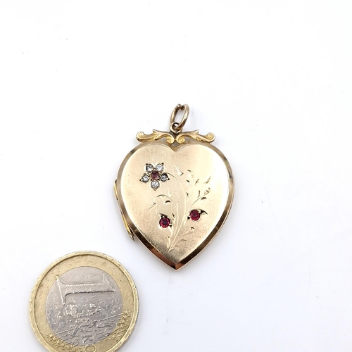 1 - A pretty 9ct gold front and back heart shaped pendant set with gemstone accents with foliate design.... 