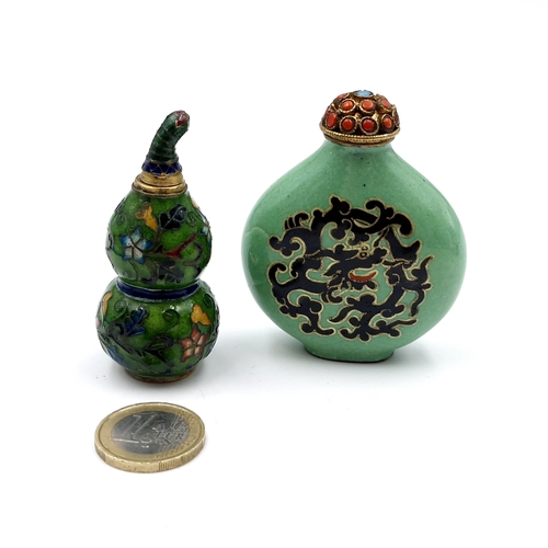 16 - A Chinese cloisonne enamel gourd snuff bottle with screw top (height - 6cm), together with another c... 