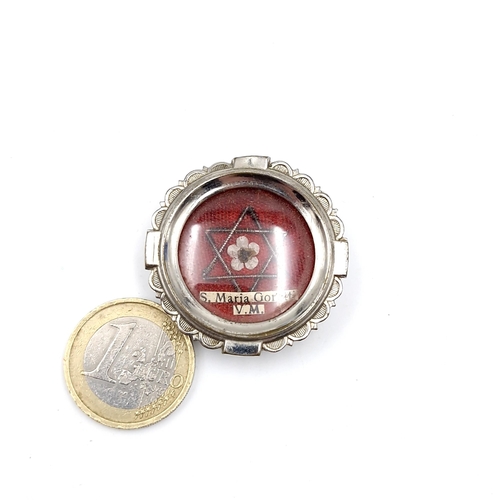 20 - An antique St Maria relic.  - 3.5cm diameter.