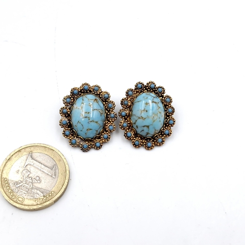 26 - A pair of lovely  vintage turquoise stone clip on clasp earrings set with turquoise stone surround. ... 