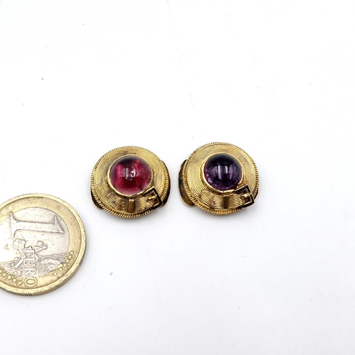 27 - A pair of 14 carat gold dress studs set with cabochon cut gem stones. Dimensions - 1.5cm diameter. T... 