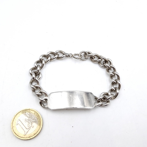 53 - An Irish silver identity bracelet with disc blank. Weight - 31 grams.