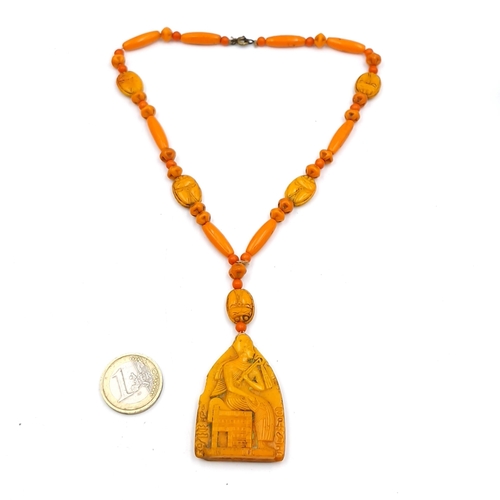 56 - A good example of a Neiger glass Egyptian revival pendant necklace. Length - 36cm. Weight 34 grams.