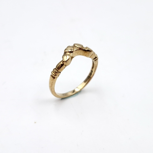 6 - A nine carat gold wishbone ring. Ring size - M1/2. Weight - 2.03g. Boxed.