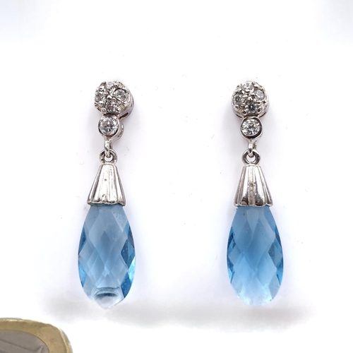 60 - A pair of sterling silver blue gemstone drop stud earrings. Length - 4cm. Weight - 5.8 grams.