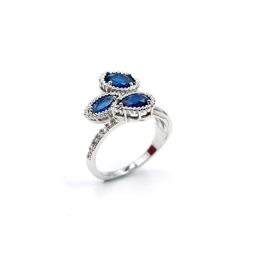 9 - An unusual three stone gemset ring, one set with heart together with gem stone mount. Set in sterlin... 