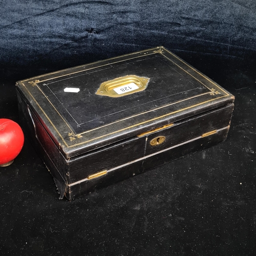 128 - A superb vintage leather bound writing slope featuring gilt gold inlay and brass handle. Opens to re... 