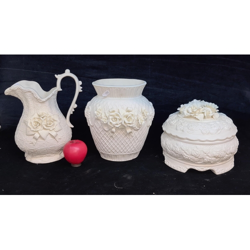 139 - A trio of large and nicely decorated white glazed ceramic items including a water pitcher jug and tw... 