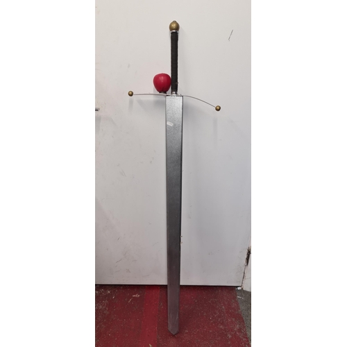 148 - A very Large reenactment sword made from wood with a metal hand guard. Perfect for Halloween. Its la... 