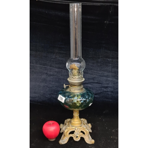 150 - A beautiful early 20th century oil lamp featuring a turquoise blue glass reservoir and tall glass ch... 