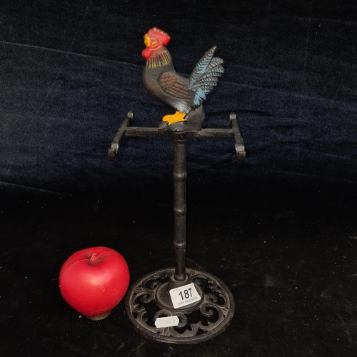 187 - A cast metal cup / mug holder stand tree that holds up to four cups. Features a rooster finial to to... 