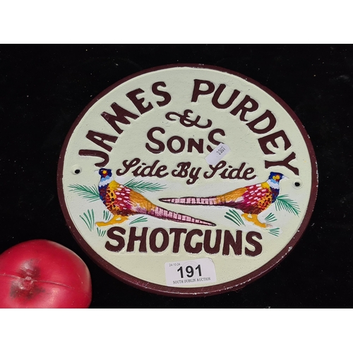 191 - A heavy cast metal circular wall plaque advertising James Purdy & Son Side by SIde Shotguns.