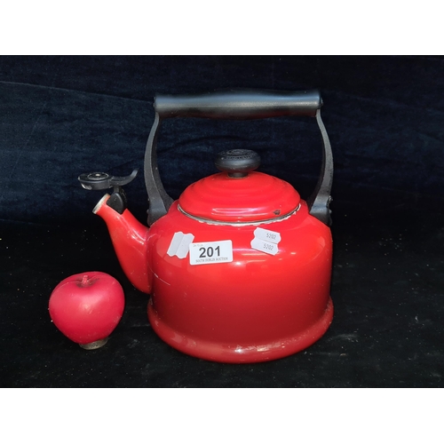 201 - A large Le Creuset stove kettle in cerise red. Similar model retailing for €135 on their website.