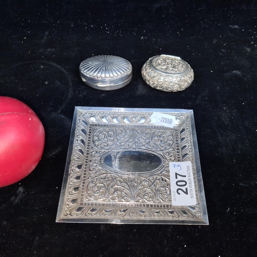 207 - Three vintage items including a continental silver pill box stamped 800, along with possibly two Ind... 