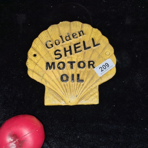 209 - A heavy cast metal wall plaque advertising Shell Motor Oil.