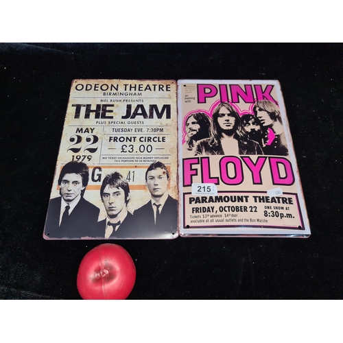 215 - A pair of printed metal wall signs of vintage concert posters including The Jam and Pink Floyd.