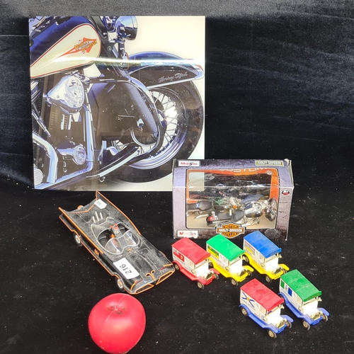 216 - A lot of seven collectible miniature model cars and motorbikes including a Maisto Harley Davidson H-... 