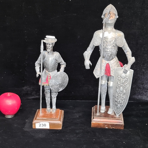 230 - Two vintage figures dressed in full body armor including one Don Quixote example. Both mounted on wo... 