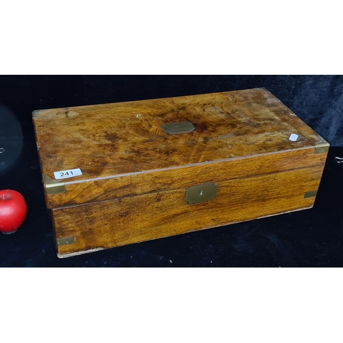 241 - A beautiful large antique walnut lidded storage box boasted brass cornering and cartouche.