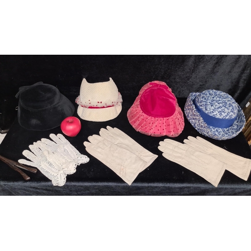 242 - A mixed lot of vintage clothing accessories including four 1930's hats, two pairs of  gloves, a glov... 