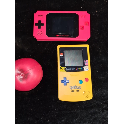 258 - Two retro handheld gaming devices including a rare Nintendo Gameboy Pikachu edition.