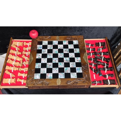 260 - A fabulous Chinese hand carved chessboard complete with all pieces, boasts beautifully craved tradit... 