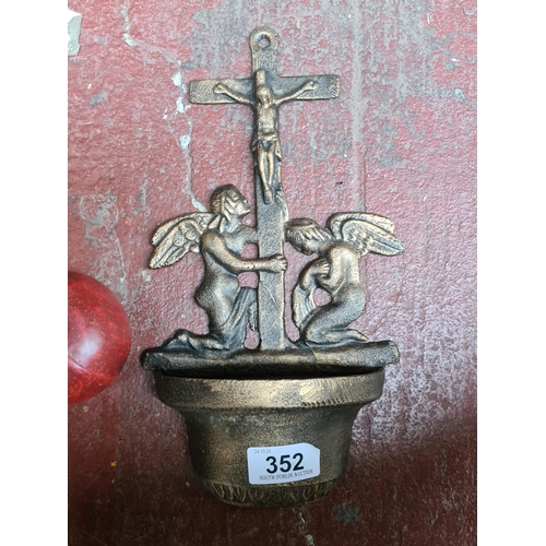 352 - A cast metal holy water font.