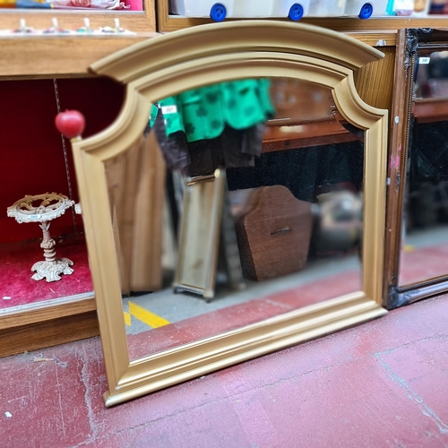 357 - A large and impressive bevelled over mantle mirror house in a gilt gold frame. MM 119cm x 108cm.