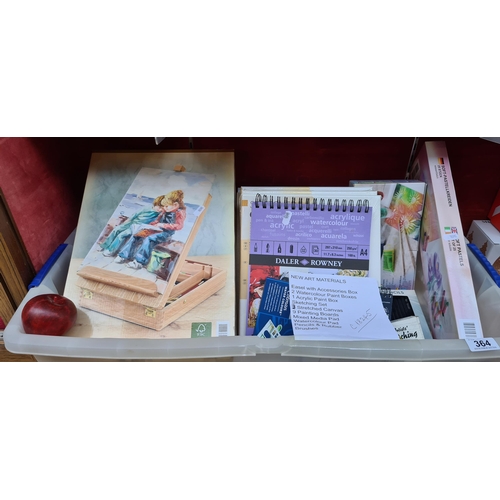 364 - A mixed lot of new art materials including an easel with accessories, brushes, two watercolour paint... 