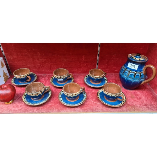 366 - A fantastic hand painted terracotta studio pottery tea set comprising of cups, saucers and teapot.