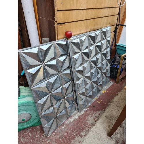 375 - Two large aluminum wall hangings in geometric relief designs, would suit indoor or out door garden d... 