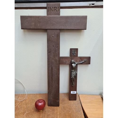 384 - Two vintage wooden religious crucifix's including one large example.