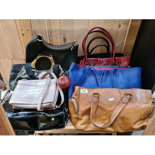 388 - A mixed lot of stylish ladies handbags including examples from Michael Kors, Jonathan Adler and Orla... 