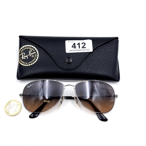 412 - A pair of Ray Ban aviator style metal framed sunglasses with detailing to frames. Lenses in good cle... 