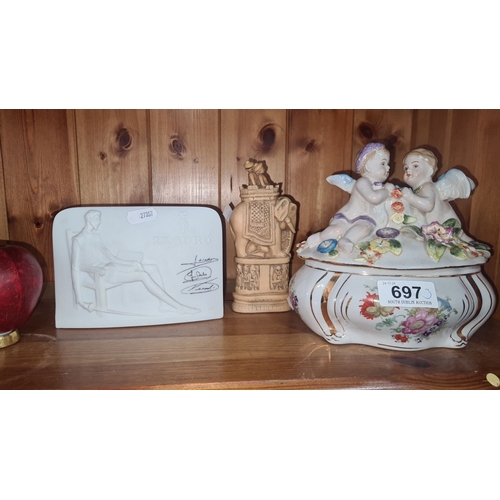 697 - Lladro Collector Society plaque features a sculpted figure, signed. It includes a carved elephant fi... 