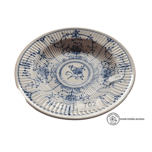 702 - An antique early Chinese Porcelain bowl with blue floral motifs, featuring ribbed detailing. Undersi... 