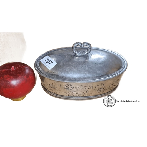 707 - Oval pewter biscuit tin dates 1774 with heart-shaped knob. Engraved 